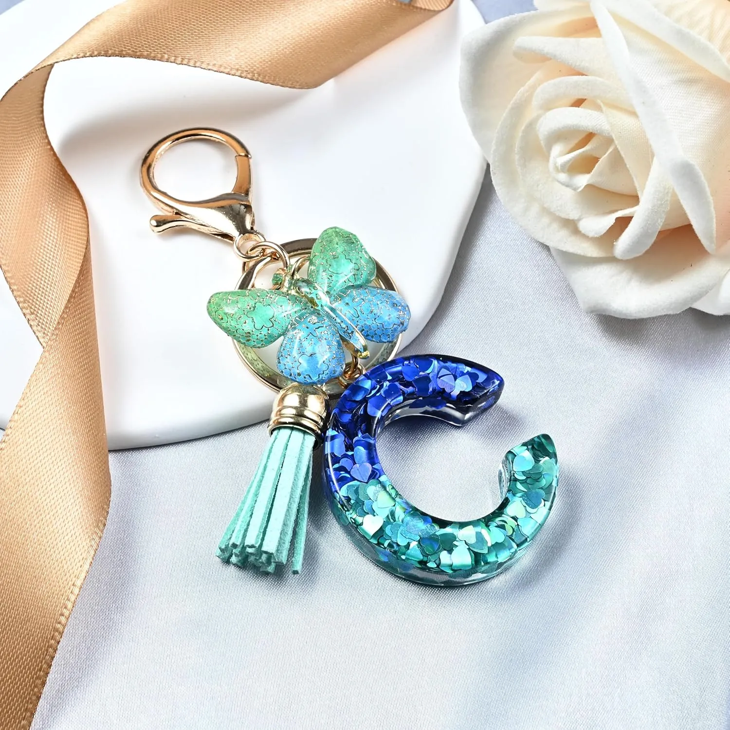 JINGUAZI Initial letter Keychains for Women Tassel Butterfly Pink Purple Cute Car Keychain for Wallet Backpack bag charm