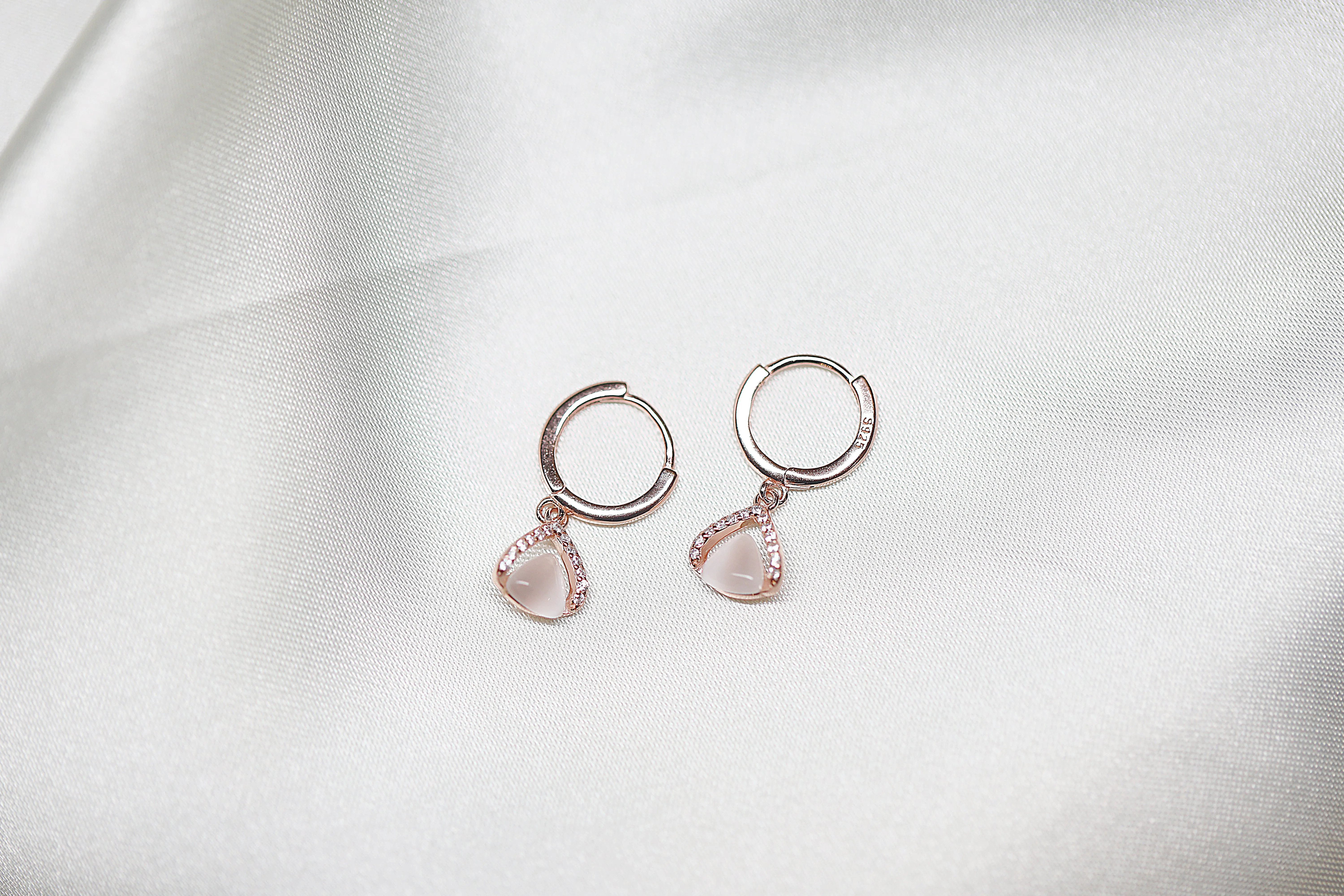 Tiny triangular rose gold hoop earrings