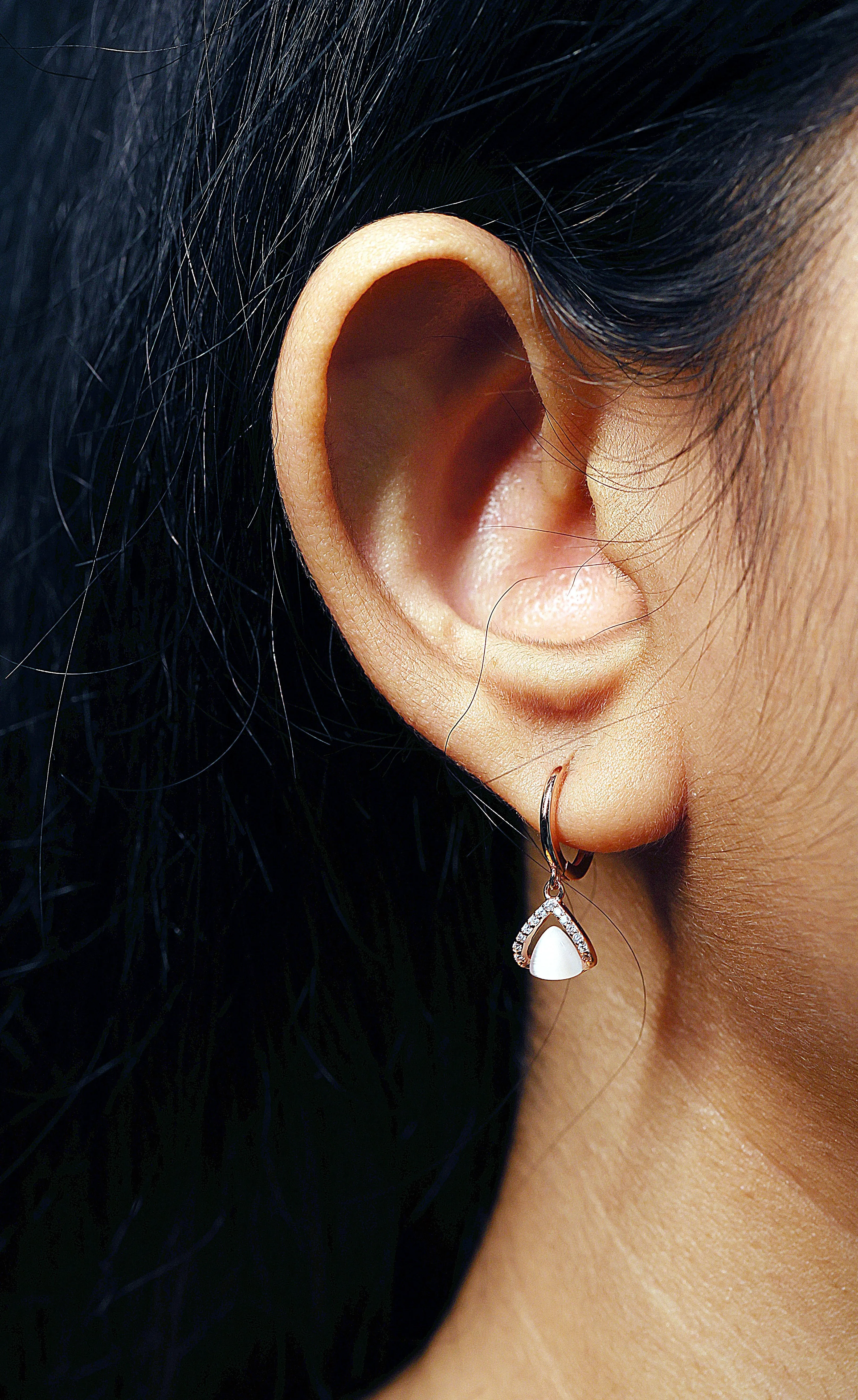 Tiny triangular rose gold hoop earrings
